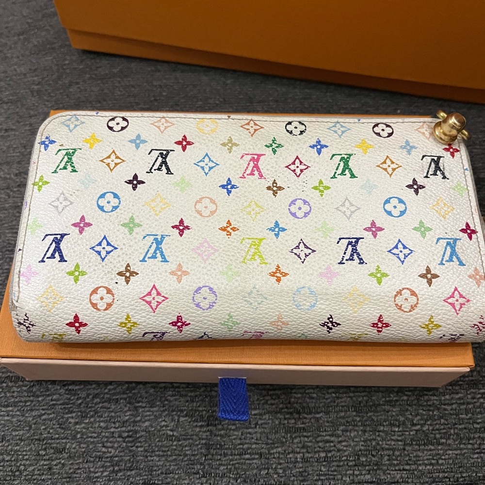Authentic multicolor zippy with rivits. Add chain for cross body if desired
